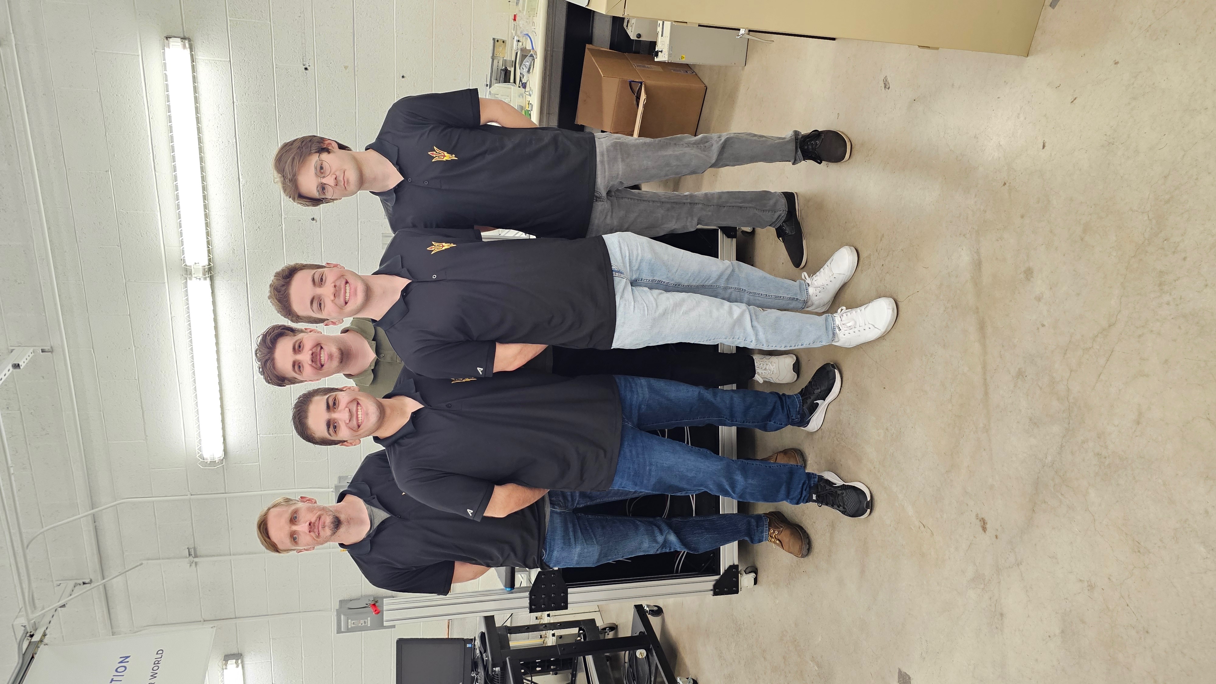 Engineering team posing together in the lab